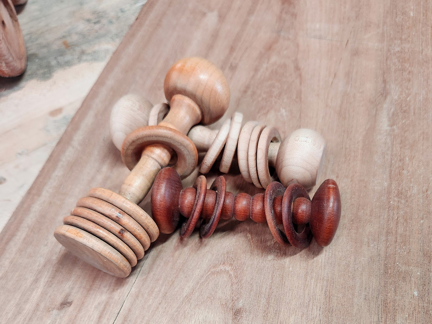 Baby rattles made from a single piece of wood.